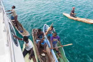 Boys in canoes